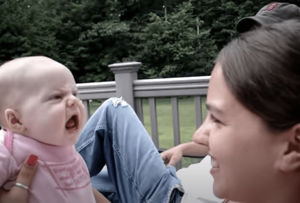 Aunt growls at baby girl making everyone laugh when baby quips back her