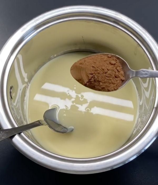 Woman mixes cocoa powder and sweetened condensed milk for meltinyour