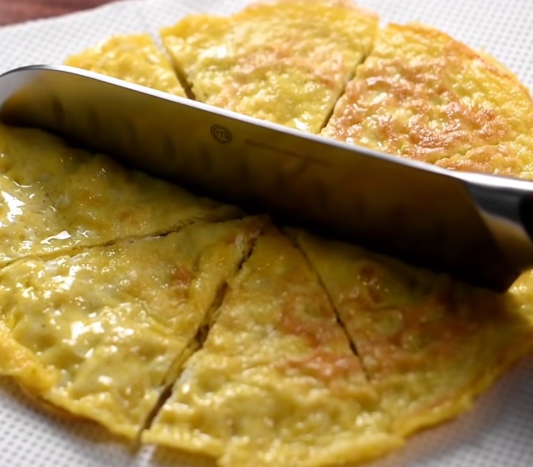 Dip eggs in flour and cook in oil to make chickenless “fried chicken”