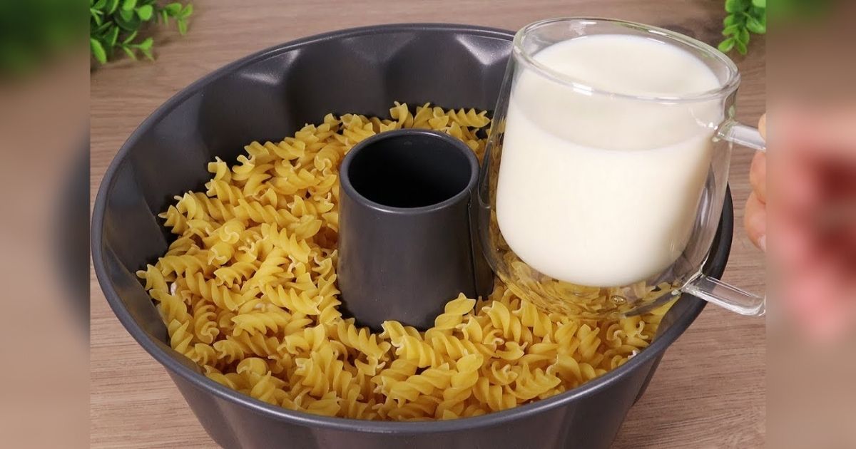 Fill bundt pan with pasta and fetta cheese then top with milk for