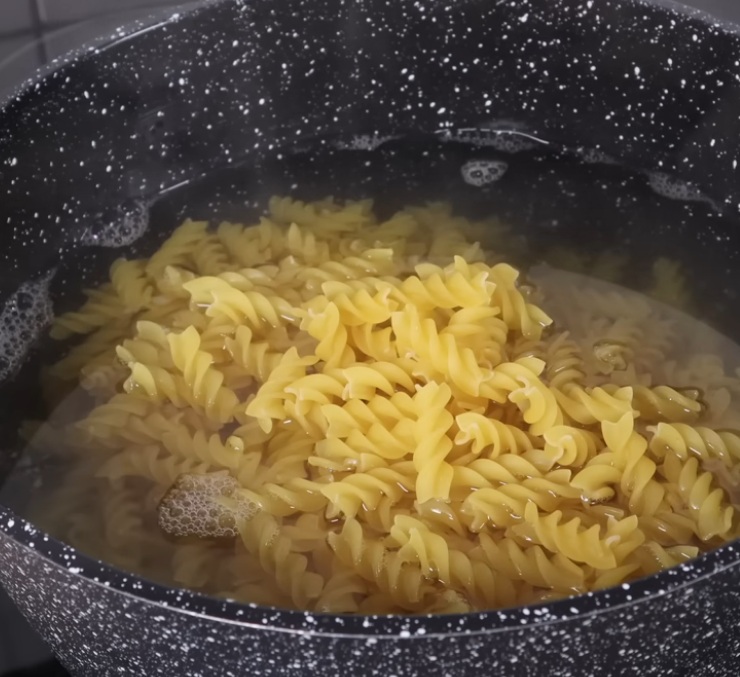 Fill bundt pan with pasta and fetta cheese then top with milk for