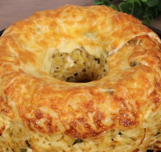 Fill bundt pan with pasta and fetta cheese then top with milk for