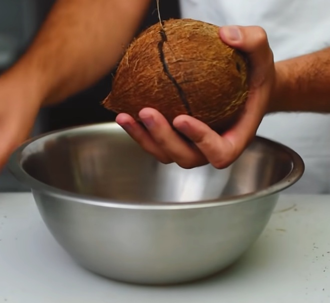 Chef shows simple way he opens coconuts without using a hammer or