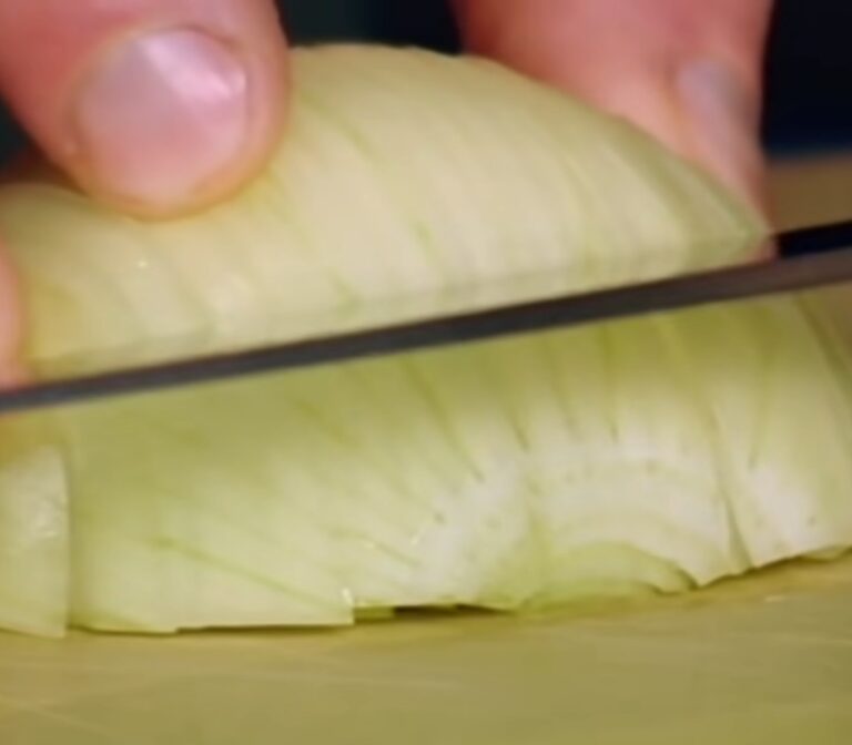 Professional chef demonstrates how to chop an onion the correct way and